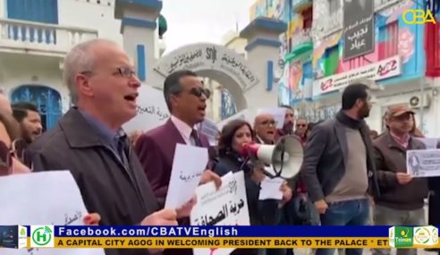 Tunisians protest over detained journalist.